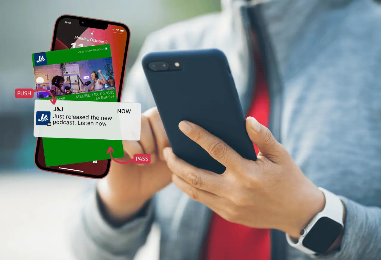 Person interacting with a smartphone, illustrating engagement triggered by a digital loyalty card notification