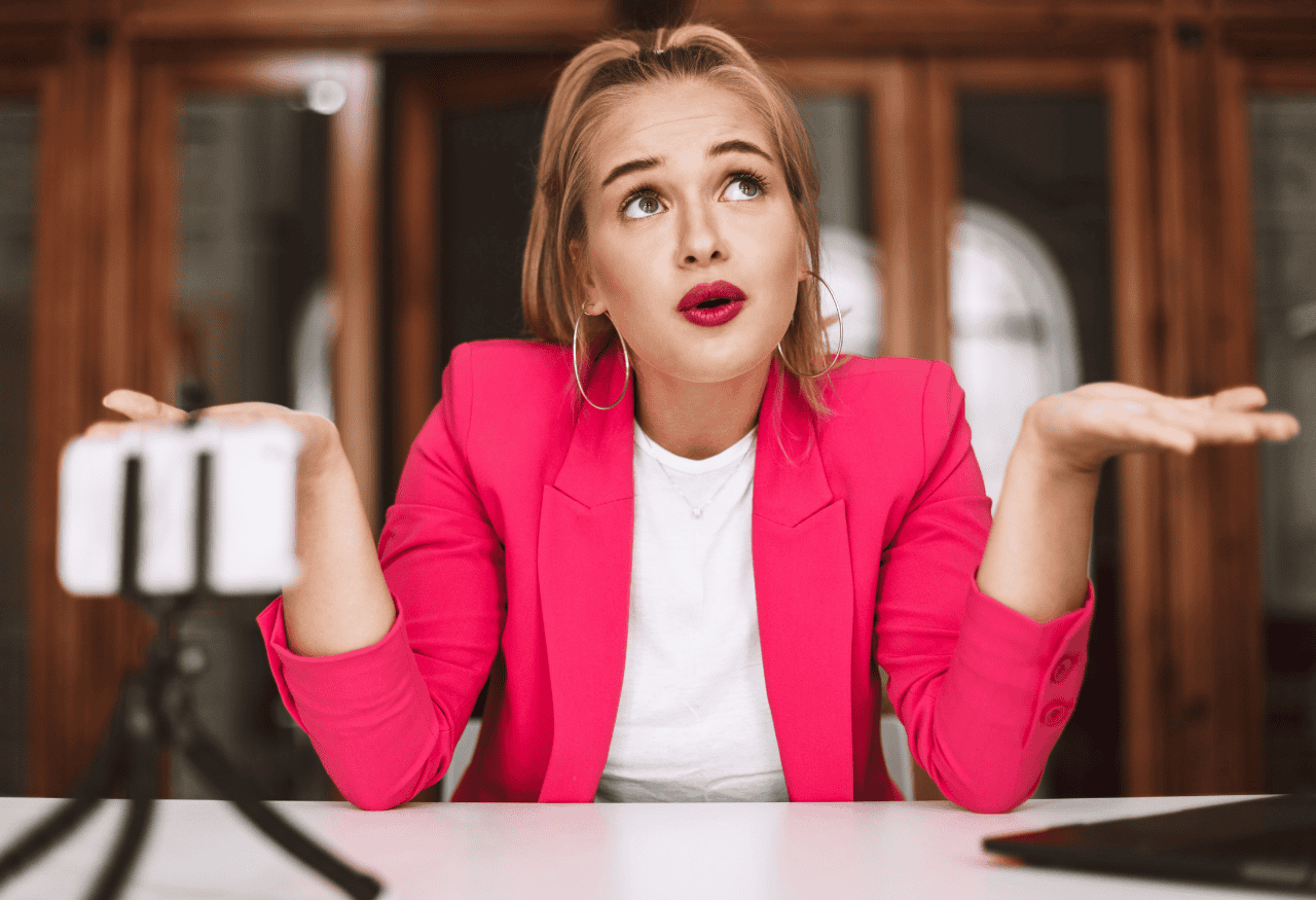 Influencer looking uncertain after filming content, illustrating how campaigns often lack infrastructure beyond initial reach