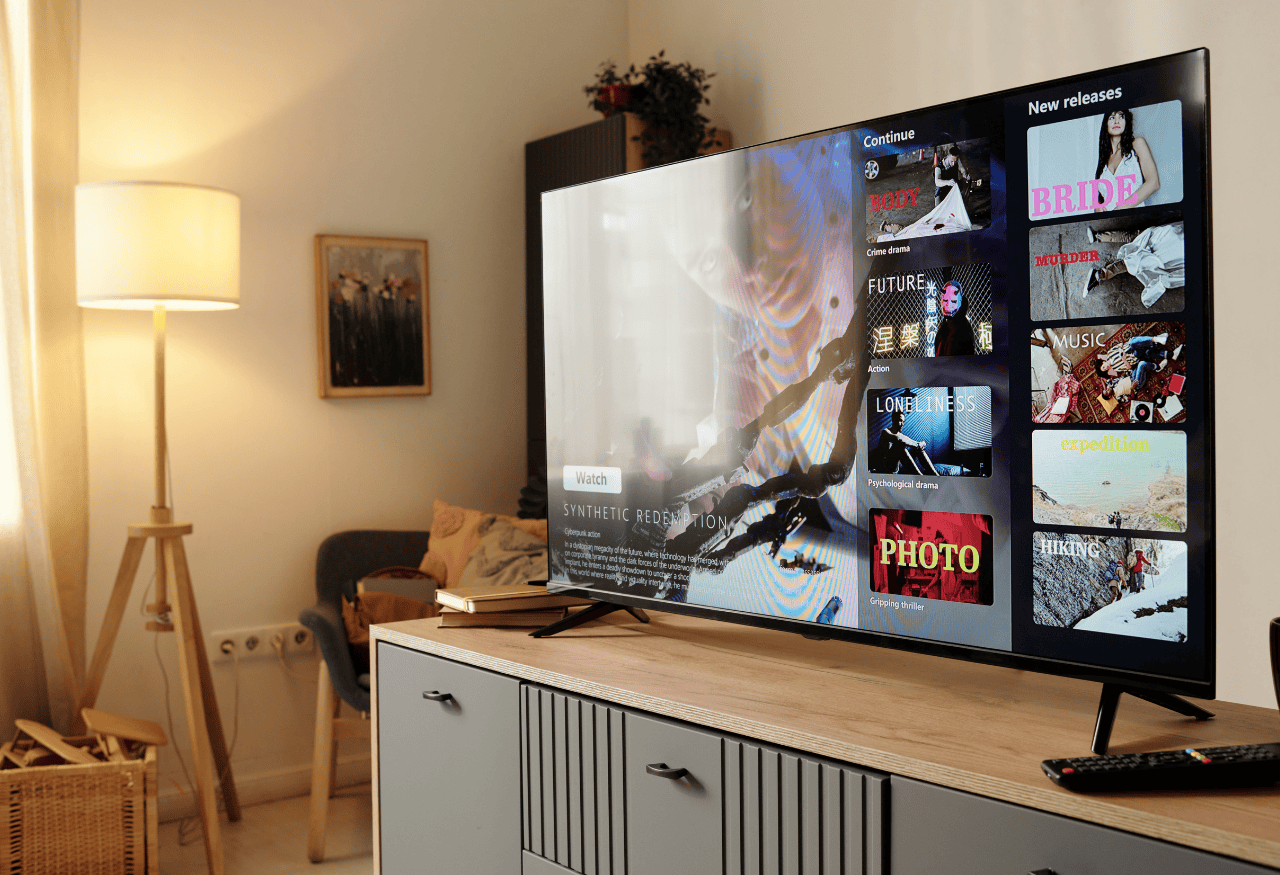Viewer watching content on a smart TV where audiences cannot click links, highlighting why QR codes are used to capture audience attention